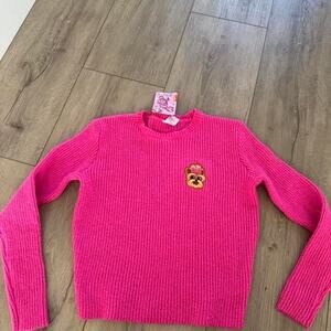 Pink ribbed knit sweater with